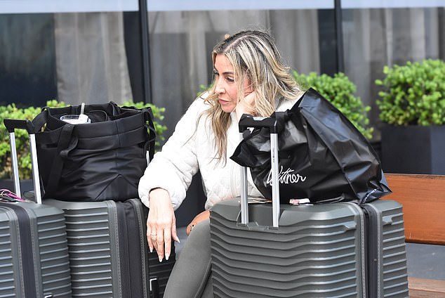 The 57-year-old mother of two was spotted waiting to be picked up sitting on a bench just metres away from photographers, leaving onlookers in awe