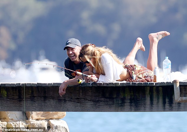 The couple laughed as they did a little fishing from the dock