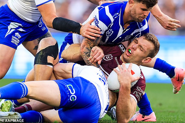 The alleged brawl broke out after Manly star Tom Trbojevic (pictured with the ball) braved a painful shoulder injury to play a starring role in his team's comeback victory.