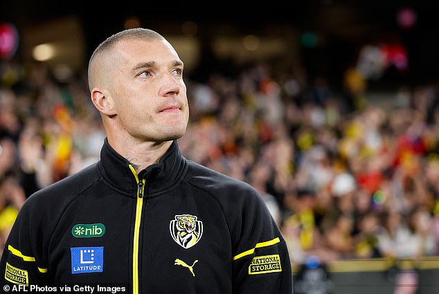 Martin is pictured giving an emotional farewell to Richmond supporters during the club's final game of the season, having confirmed his 'retirement' just weeks earlier