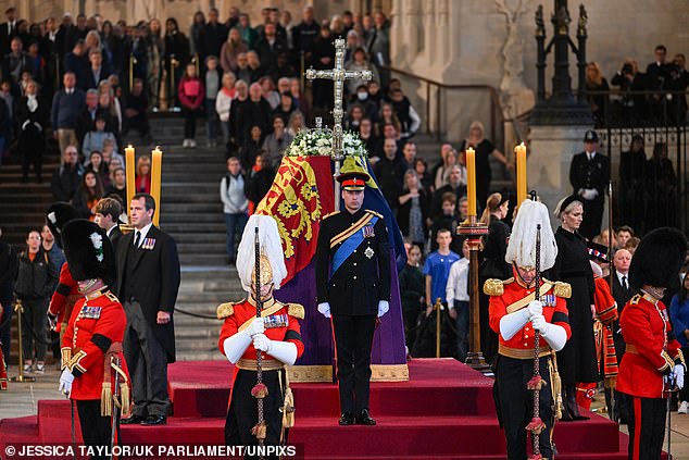 Prince William stands at one end of the coffin, while the other grandchildren stand to the sides and Harry at the other end