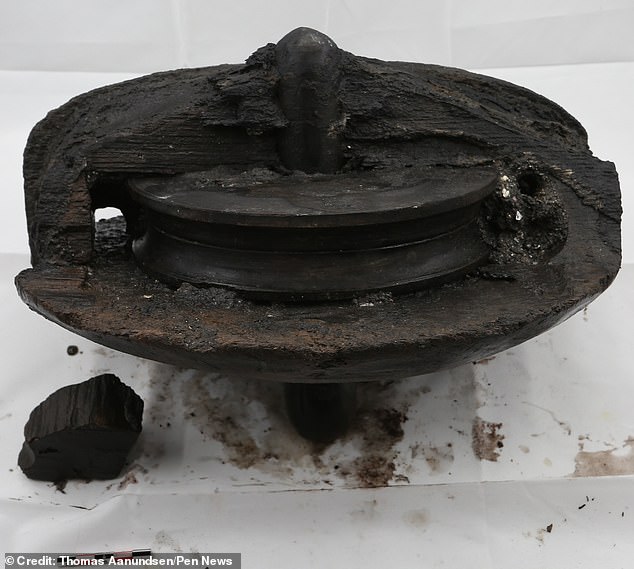 Photo shows a pulley wheel recovered from the wreck