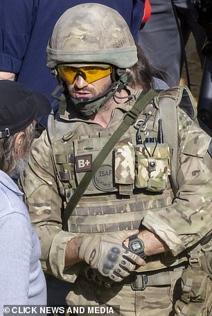 Aaron was dressed to the nines with a bulletproof vest and a helmet