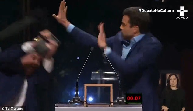 Brazilian TV host and mayoral candidate Jose Luiz Datena threw the iron chair over his political rival's head