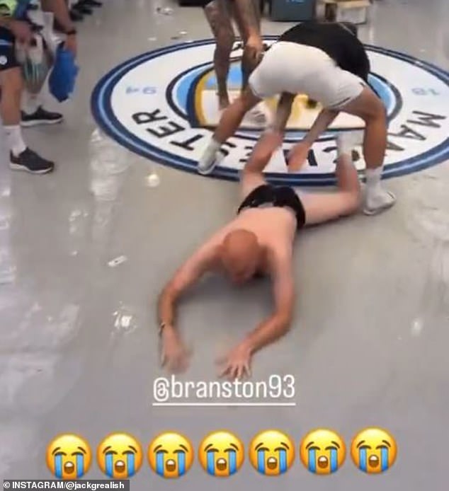 Ashton celebrated City's titles by sliding across the floor in his black underpants