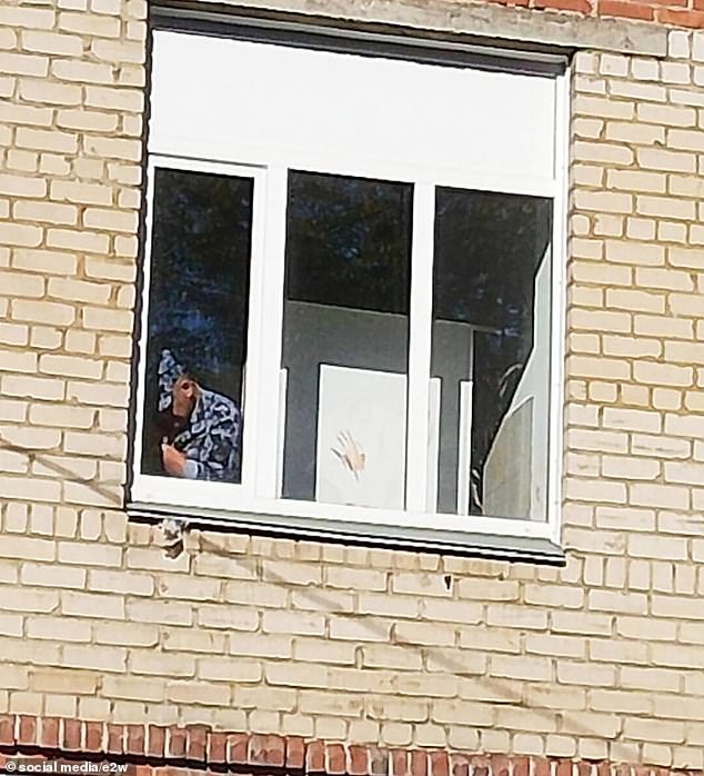 A handprint left on the window of the school in Chelyabinsk after the attack on the school