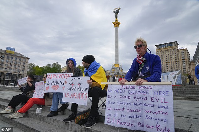 Ryan Wesley Routh, right, takes part in a rally in downtown Kiev, Ukraine, Saturday, April 30, 2022