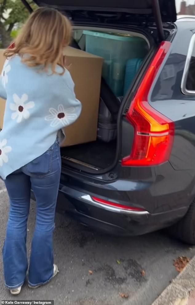 She was filmed loading boxes into the back of her car as it sat on the kerb outside their North London home