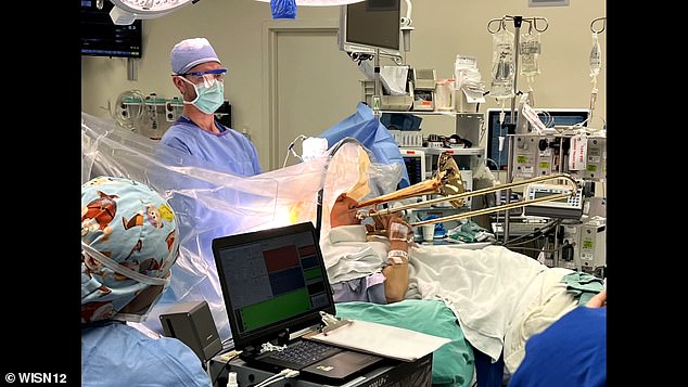 The surgery required Rust to remain awake, so he asked Lake if he could take the trombone into the operating room. PICTURED: Dr. Wendall Lake (left) and Brian Rust (right)