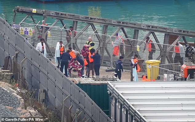 A group of people believed to be migrants are taken to Dover, Kent from a Border Force ship following an incident involving a small boat in the Channel. Pictured on September 4, 2024