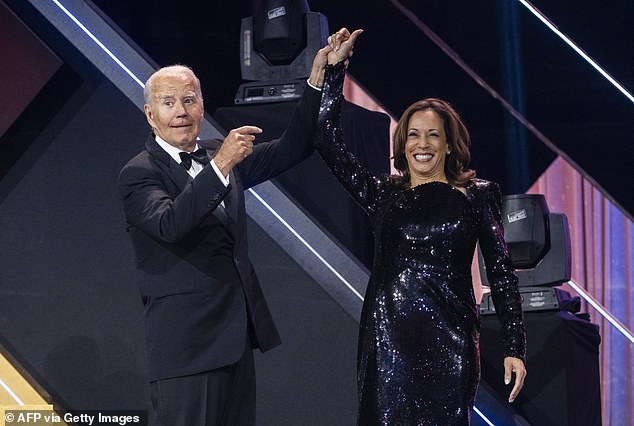 U.S. President Joe Biden welcomes Vice President and Democratic presidential nominee Kamala Harris to the stage during the 2024 Phoenix Awards Dinner at the Washington Convention Center in Washington, DC, on September 14, 2024