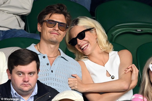 The singer and actress met her current husband, model Oliver Cheshire, 36, a year after she shot to fame at a 2010 runway show and they got engaged in 2016, married in 2022 and then welcomed their son in November (pictured together at Wimbledon in July)