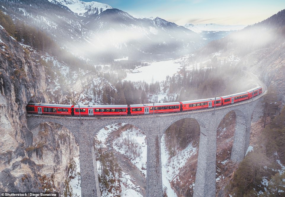 The Swiss Glacier Express (above) 'opens up stunning Alpine scenery and winds over 291 bridges'