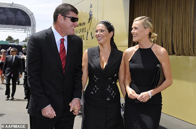 James Packer, his then wife Erica and Lachlan Murdoch's wife Sarah Murdoch arrive at the Birdcage on Derby Day at Flemington Racecourse in Melbourne