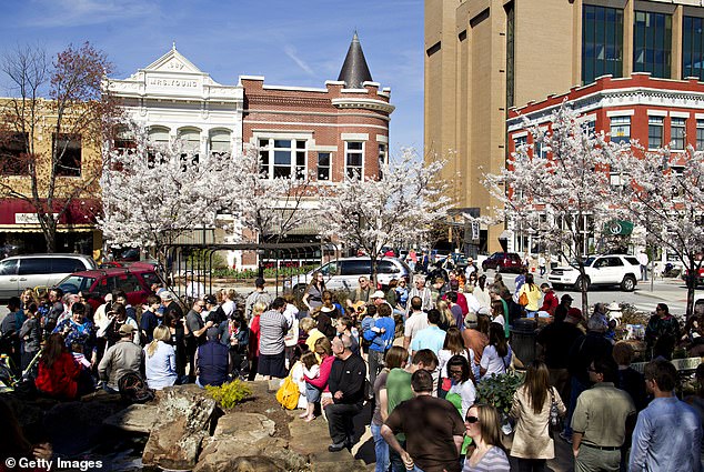 Fayetteville, Arkansas, makes the list for what it has to offer nature-loving retirees (pictured: residents enjoy the city's Saturday morning farmers market)