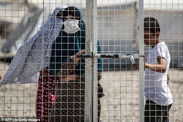 Al-Roj holds approximately 2,600 prisoners from 55 countries, many of whom are ISIS brides and their children (pictured is a woman in the al-Hol camp in northeastern Syria)