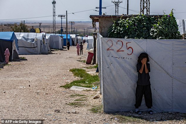 Many people living in the camp are unable to access fresh food, clean water and medicine (pictured is a child hiding in al-Roj in 2023).