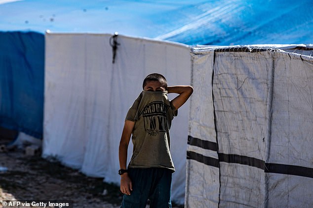 A boy living in al-Roj camp is photographed in October last year