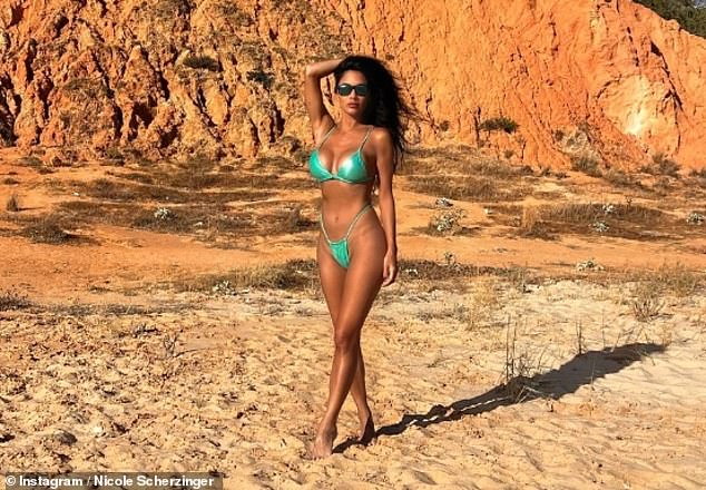 The hitmaker has been enjoying the sun with her fiancé Thom Evans and wrote in her post that she wanted to enjoy the summer 'a little longer'.