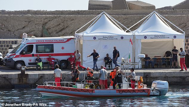 Search teams at the site of the Bayesian collapse as they prepare to resume the search for Hannah Lynch on August 23