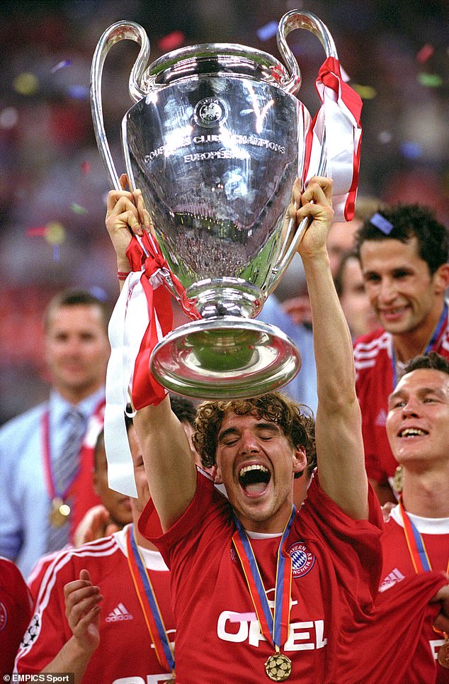 Hargreaves pictured holding the Champions League trophy aloft in 2001 while still a Bayern player