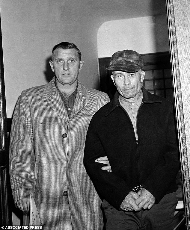 Waushara County Sheriff Art Schley, left, escorts Gein from Plainfield, Wisconsin to the Central State Hospital for the Criminally Insane on November 23, 1957 in Milwaukee