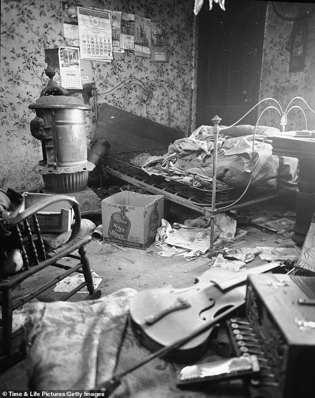 A photo shows a filthy room in the Plainfield, Wisconsin home of murderer and body snatcher Ed Gein in November 1957.