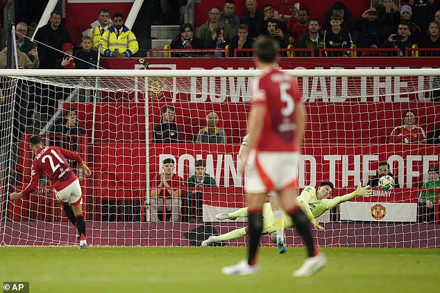 Antony fires the ball past Barnsley keeper Slonina to make it 2-0 for United