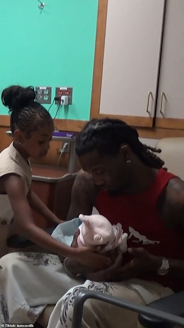 Her estranged husband Offset, 32, and their older children, Kulture, six, and Wave, three, were also in attendance at the celebration, where they hugged their new sibling warmly with their proud parents