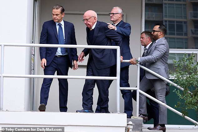 Murdoch arrived at the courthouse Tuesday in a convoy of three SUVs and walked carefully up the steps to a side entrance of the courthouse