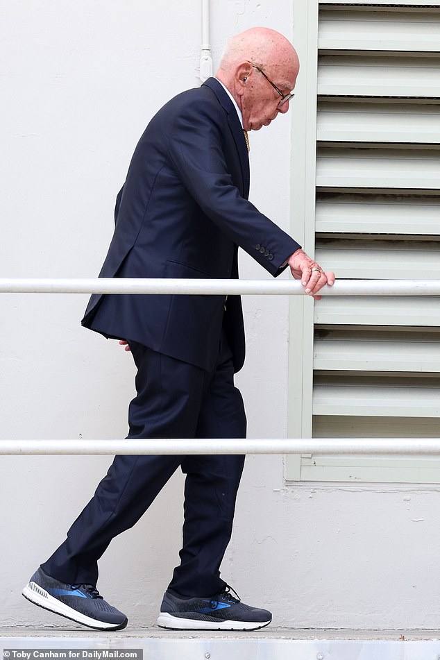 Murdoch holds onto the railing for support as he leaves the field on Tuesday afternoon