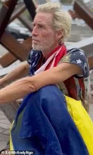 He is pictured above, draped in the American and Ukrainian flags