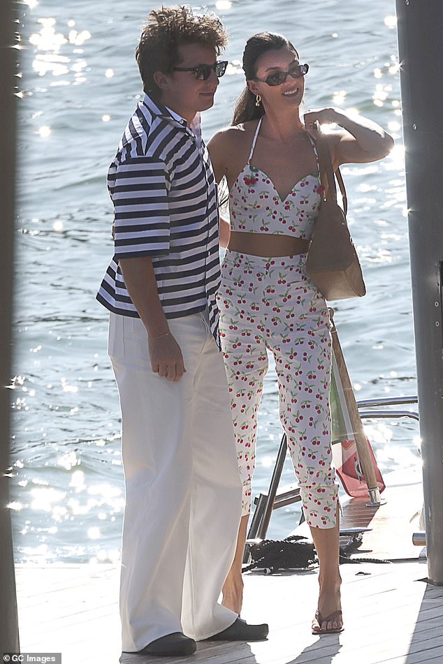 Charlie looked relaxed in a striped shirt and white pants, while Brooke wore a matching bra and pants with a cheerful pattern