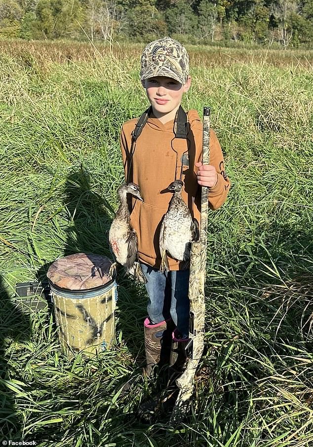 Owen, a regular hunter, was prepared for an event like this, firing his rifle and killing the bear that would eventually roll off his father. Pictured: Owen carries hunted birds around his neck during a hunting trip in October 2023