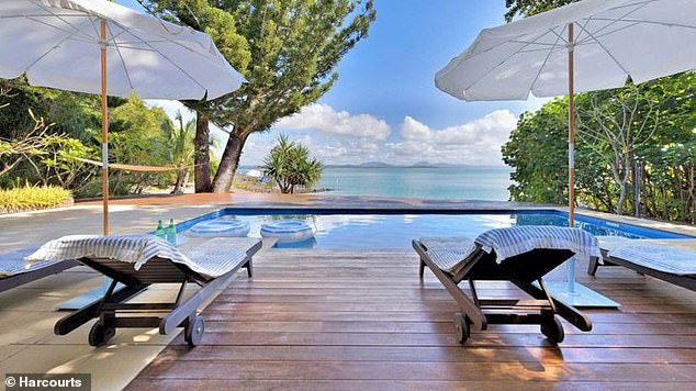 The main house on Little Green Island features a swimming pool with sweeping views over the Coral Sea