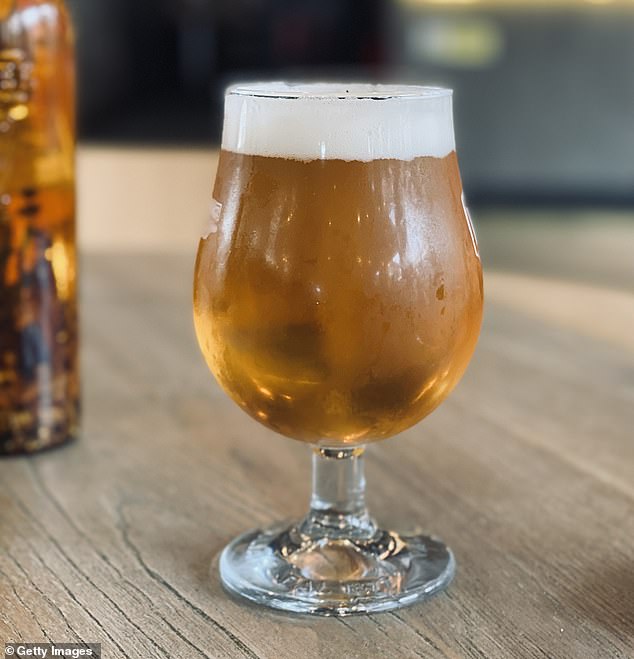 Because people tend to order a set number of drinks rather than a specific amount, swapping a pint for a two-thirds glass (pictured) means drinkers consume less alcohol (stock image)