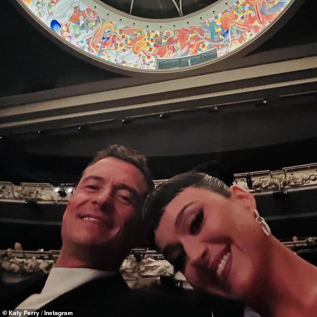 The collection of snaps was accompanied by a cute selfie of the couple while sitting in the audience at an event