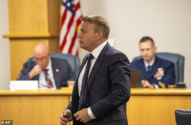 Former OceanGate Director of Marine Operations David Lochridge, center, stands during his testimony, Tuesday, September 17, 2024, before the Titan Marine Board's formal hearing at the Charleston County Council Chambers, in North Charleston, S.C.