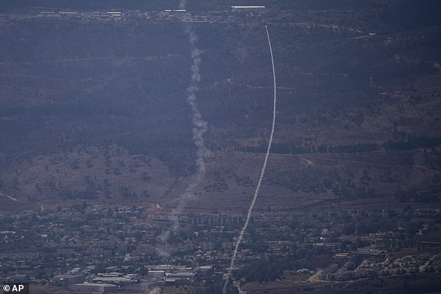 Israel's Iron Dome air defense system fires to intercept an attack from Lebanon on the Galilee region, near Kiryat Shmona, as seen from the Israeli-annexed Golan Heights, Tuesday, Sept. 17, 2024