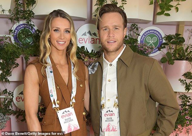 Olly and his wife of one year still appear as in love as ever and the singer revealed that despite having a newborn baby, the couple's sex life hasn't suffered (pictured at Wimbledon in July)