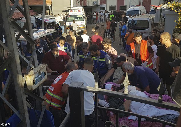 Civil Protection workers carry a man who was injured after his portable pager exploded, in the southern port city of Sidon, Lebanon, Tuesday, September 17, 2024