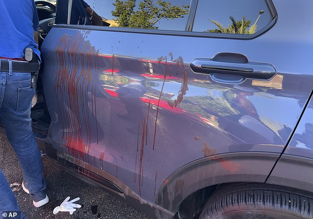 A police officer inspects a car in which a pager has exploded, in Beirut, Lebanon, Tuesday, September 17, 2024