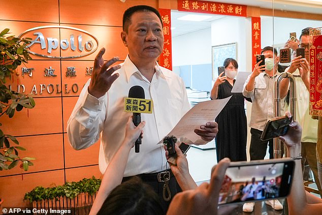 Hsu Ching-kuang (left), head of Taiwanese company Gold Apollo, speaks to media outside the company's office in New Taipei City on September 18, 2024. Taiwanese company Gold Apollo denied a report on September 18 that it had produced thousands of explosive-filled beepers