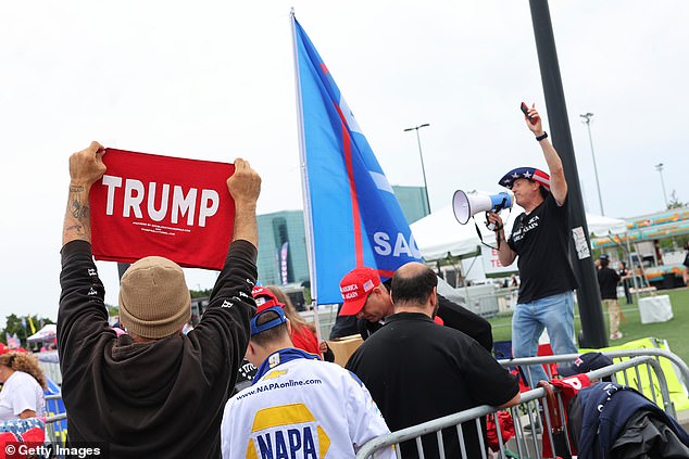 Supporters of Republican presidential candidate, former US President Donald Trump, wait for the start of his campaign rally in Nassau