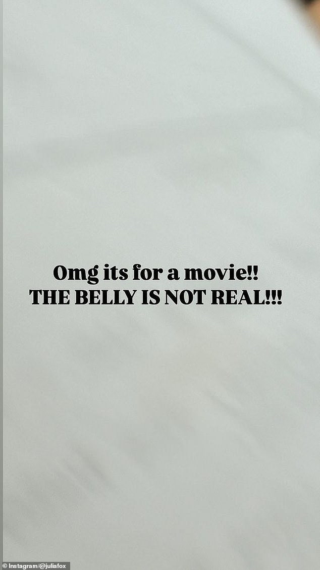 On a blank background, she wrote in all caps: 'OMG this is for a movie!! THE BELLY IS NOT REAL!!!' The model did not provide further details about her project.