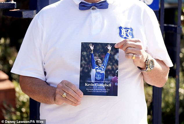 The memorial service program showed Campbell with his arms raised and a bright smile on his face