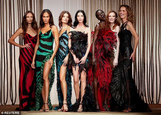 The models all had smiles on their faces as they posed together at the end of the show to show off the styling line; pictured L-R Natasha Poly, Joan Smalls, Isabeli Fontana, Mariacarla Boscono, Alek Wek, Karen Elson and Eva Herzigova