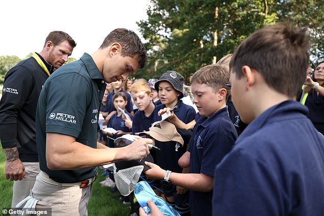 He signed some autographs for some young fans while on the course at Wentworth Club