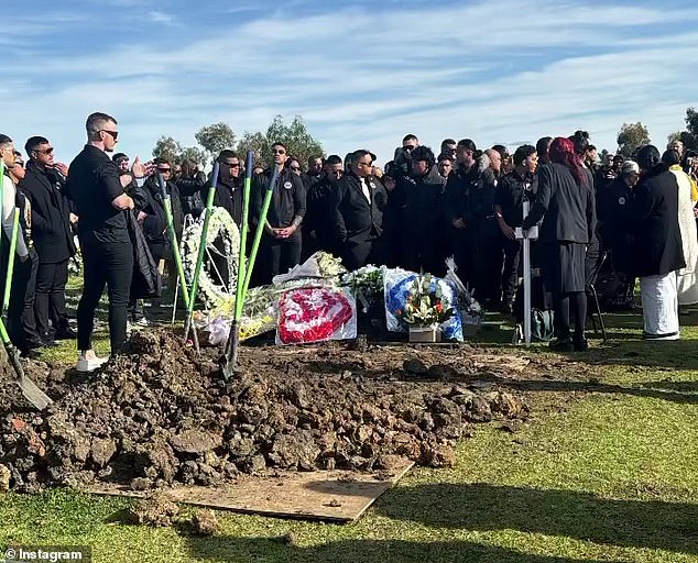 Friends and family are seen laying Vincent Atulia to rest on Tuesday