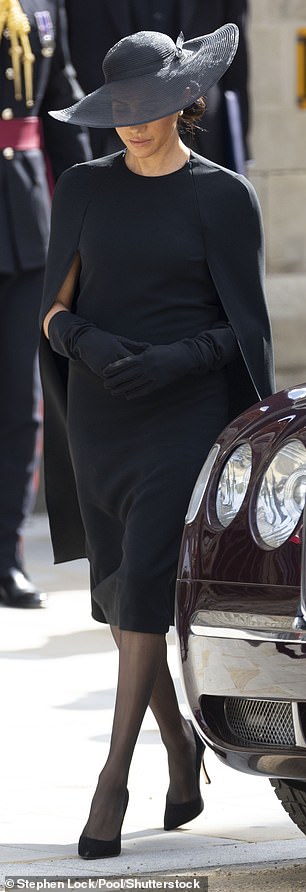 Meghan, Duchess of Sussex, opted for a Stella McCartney cape dress, paired with a lavish Stephen Jones hat